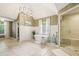 Spacious bathroom featuring a freestanding tub, a glass-enclosed shower, and modern finishes at 700 Winterwind Way, Roswell, GA 30075