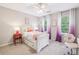 Cozy bedroom with purple ombre curtains, white furniture, and plush carpet at 700 Winterwind Way, Roswell, GA 30075