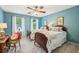A bedroom featuring two beds with colorful bedding, and natural light at 700 Winterwind Way, Roswell, GA 30075