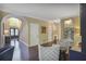 Welcoming entryway boasting a large archway, hardwood floors, and ample space for receiving guests at 700 Winterwind Way, Roswell, GA 30075