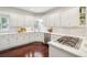 Modern kitchen with white cabinets, stainless steel appliances, and granite countertops at 700 Winterwind Way, Roswell, GA 30075