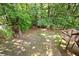 Spacious, wooded backyard with a deck at 2355 Twelvestones Dr, Roswell, GA 30076