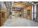 Unfinished basement with exposed beams and lots of open space at 2355 Twelvestones Dr, Roswell, GA 30076