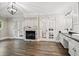 Bright bathroom boasting a fireplace, french doors and dual vanities with black granite countertops at 2355 Twelvestones Dr, Roswell, GA 30076