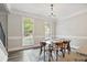 Formal dining room featuring hardwood floors and large windows at 2355 Twelvestones Dr, Roswell, GA 30076
