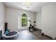 Bright workout space featuring a stationary bike and natural light at 2355 Twelvestones Dr, Roswell, GA 30076