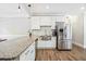 Spacious kitchen boasts stainless steel appliances, granite countertops, and a stainless farmhouse sink at 2355 Twelvestones Dr, Roswell, GA 30076