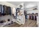 Large walk-in closet with custom shelving and storage solutions for an organized wardrobe at 2355 Twelvestones Dr, Roswell, GA 30076