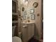 Cozy bathroom with custom decorations, vanity, and mirror at 6193 Charring Cross Ct, Lithonia, GA 30058