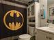 Quirky bathroom with unique shower curtain, vanity, and toilet at 6193 Charring Cross Ct, Lithonia, GA 30058