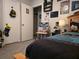 Cozy bedroom with carpet, storage, and various Batman decorations on the wall at 6193 Charring Cross Ct, Lithonia, GA 30058