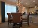 Cozy dining area features a modern chandelier and counter seating at 6193 Charring Cross Ct, Lithonia, GA 30058