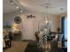 Cozy dining area with modern chandelier, sleek table, and a decorative centerpiece at 6193 Charring Cross Ct, Lithonia, GA 30058
