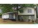 Charming two-story home with stone accents, well-maintained lawn, and inviting curb appeal at 6193 Charring Cross Ct, Lithonia, GA 30058