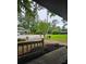 Well-maintained front yard with lush lawn, mulch, landscaping, and a view of the street at 6193 Charring Cross Ct, Lithonia, GA 30058