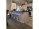 An eat-in kitchen with stainless steel appliances and counter stools at 6193 Charring Cross Ct, Lithonia, GA 30058