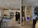 Open-concept living room showcasing the kitchen and stairs to the upstairs rooms at 6193 Charring Cross Ct, Lithonia, GA 30058