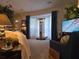 Spacious living area featuring stylish décor, large windows with curtains, and plenty of natural light at 6193 Charring Cross Ct, Lithonia, GA 30058
