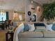 Inviting living area featuring plush seating, decorative pillows, and an open layout to the kitchen at 6193 Charring Cross Ct, Lithonia, GA 30058