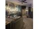 Spacious living room features comfortable seating, themed decor, and shelving displays, creating a stylish and inviting space at 6193 Charring Cross Ct, Lithonia, GA 30058