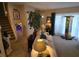 Cozy living room with neutral tones, plush seating, and a staircase leading to the upper level at 6193 Charring Cross Ct, Lithonia, GA 30058