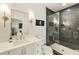 Modern bathroom with tiled shower, sleek vanity, and contemporary fixtures at 214 Kenneth Drive, Alpharetta, GA 30009