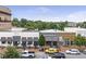 Attractive commercial building exteriors, with outdoor seating and street parking at 214 Kenneth Drive, Alpharetta, GA 30009