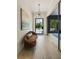 Inviting foyer with hardwood floors, stylish lighting, and a cozy seating area at 214 Kenneth Drive, Alpharetta, GA 30009