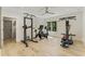 Spacious home gym equipped with workout machines and hardwood floors at 214 Kenneth Drive, Alpharetta, GA 30009