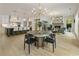Open-concept living room with a fireplace, round table, and kitchen view offers a spacious layout at 214 Kenneth Drive, Alpharetta, GA 30009