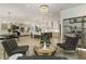 Inviting living area featuring a fireplace, a bar, and open layout with a view to the kitchen at 214 Kenneth Drive, Alpharetta, GA 30009