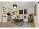Bright living space featuring custom built-ins, modern lighting, and stylish decor at 214 Kenneth Drive, Alpharetta, GA 30009