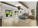Inviting primary bedroom with hardwood floors, beamed ceiling, and plenty of natural light at 214 Kenneth Drive, Alpharetta, GA 30009
