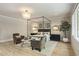 Bright main bedroom with canopy bed, sitting area, and decorative tree at 214 Kenneth Drive, Alpharetta, GA 30009