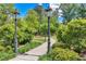 Serene park pathway lined with lush greenery and vintage-style lampposts at 214 Kenneth Drive, Alpharetta, GA 30009