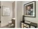 Stylish powder room with elegant decor, a vanity, and unique accents adds a touch of sophistication at 214 Kenneth Drive, Alpharetta, GA 30009