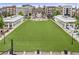 Attractive town green flanked by mixed-use buildings offers a lively outdoor public space for dining, leisure, and community events at 214 Kenneth Drive, Alpharetta, GA 30009