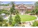 Beautiful town green space with trees, a pond, and a view of a historic brick building at 214 Kenneth Drive, Alpharetta, GA 30009