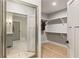 View into the bathroom from the walk-in closet and into the attached bathroom at 214 Kenneth Drive, Alpharetta, GA 30009