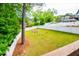 Large backyard with lush lawn enclosed by a white fence, offering a secure and private outdoor space for recreation at 2253 Carrington Dr, Ellenwood, GA 30294