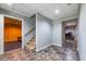 Basement featuring modern flooring, neutral walls, and access to multiple rooms, offering potential for various uses at 2253 Carrington Dr, Ellenwood, GA 30294
