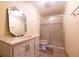 Classic bathroom with a white vanity, marble-style countertop, frosted shower doors, and neutral tiling at 2253 Carrington Dr, Ellenwood, GA 30294
