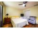Bright bedroom featuring a ceiling fan, classic furnishings, and ample natural light, creating a cozy, inviting space at 2253 Carrington Dr, Ellenwood, GA 30294