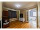Bright bedroom featuring hardwood floors and doorway view to the adjacent Primary bathroom with tub at 2253 Carrington Dr, Ellenwood, GA 30294