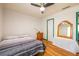 Well-lit bedroom featuring a comfortable bed, classic wooden furnishings, and charming decor for a relaxing ambiance at 2253 Carrington Dr, Ellenwood, GA 30294