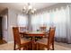 Dining room featuring a wooden table with seating for four and natural lighting at 2253 Carrington Dr, Ellenwood, GA 30294