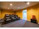 Basement theater room equipped with comfortable seating, recessed lighting, and a snack station for ultimate viewing pleasure at 2253 Carrington Dr, Ellenwood, GA 30294