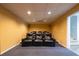Basement home theater featuring plush seating, warm lighting, and a cozy atmosphere for immersive entertainment experiences at 2253 Carrington Dr, Ellenwood, GA 30294