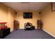 Home theater in basement featuring comfortable seating, warm lighting, and snack preparation for immersive movie nights at 2253 Carrington Dr, Ellenwood, GA 30294