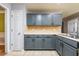 Kitchen featuring stainless steel appliances, ample cabinet space, and tiled floors at 2253 Carrington Dr, Ellenwood, GA 30294